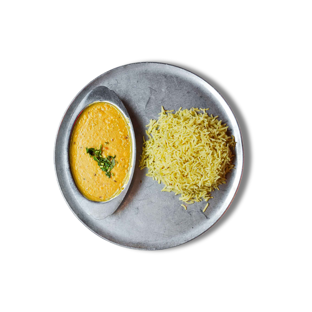 Zareen's Tarka Daal features slow-simmered yellow lentils with flavorful Indian spices and caramelized onions, offering rich and comforting goodness. Served with Zareen's basmati rice.