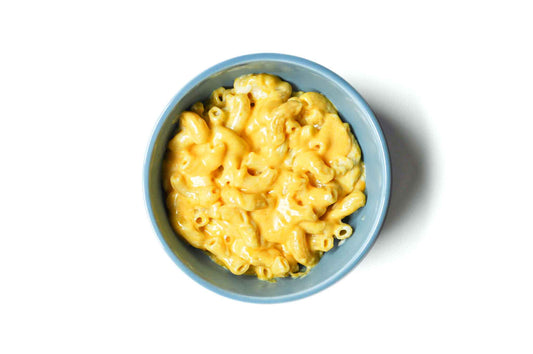 Homeroom's Classic Mac features perfectly cooked elbow macaroni coated in a rich, creamy cheddar cheese sauce. This comforting dish is a timeless favorite, offering the ultimate blend of cheesy goodness and comforting nostalgia in every bite.