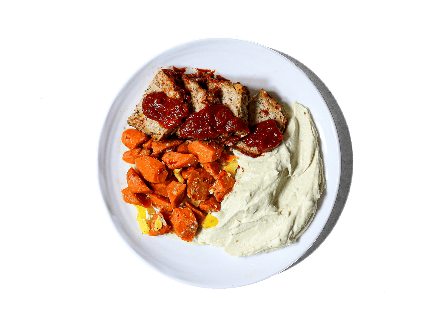 A comforting classic, featuring a perfectly seasoned turkey loaf topped with homemade ketchup for a tangy glaze. Served alongside creamy celeriac and parsnip puree and sweet glazed carrots, this hearty meal is a wholesome, satisfying twist on a timeless favorite.