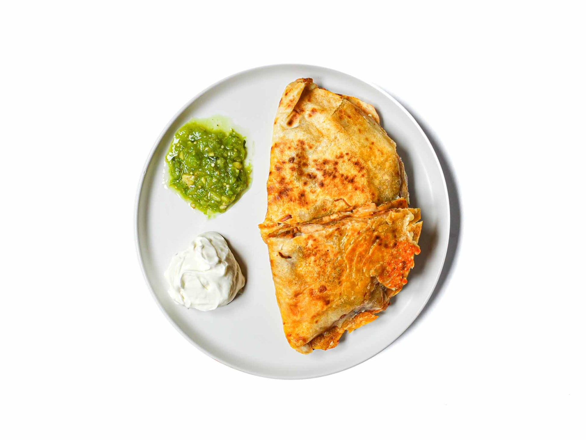 El Faralito's chicken quesadilla is a scrumptious blend of seasoned grilled chicken, melted cheese nestled between golden, crispy tortillas. A satisfying harmony of flavors and textures that delivers a delightful taste of Mexico in each bite.