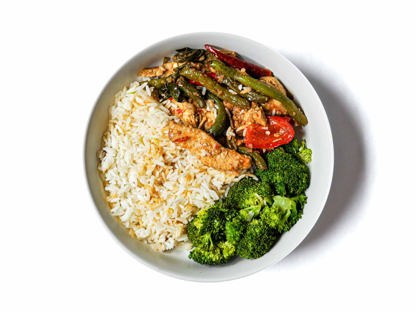 Burma Classic's Fiery Chicken is a spicy and flavorful dish. Tender chicken stir-fried with bell peppers, green beans, and a sweet-spicy sauce, taking you on a delicious journey to vibrant Burma.