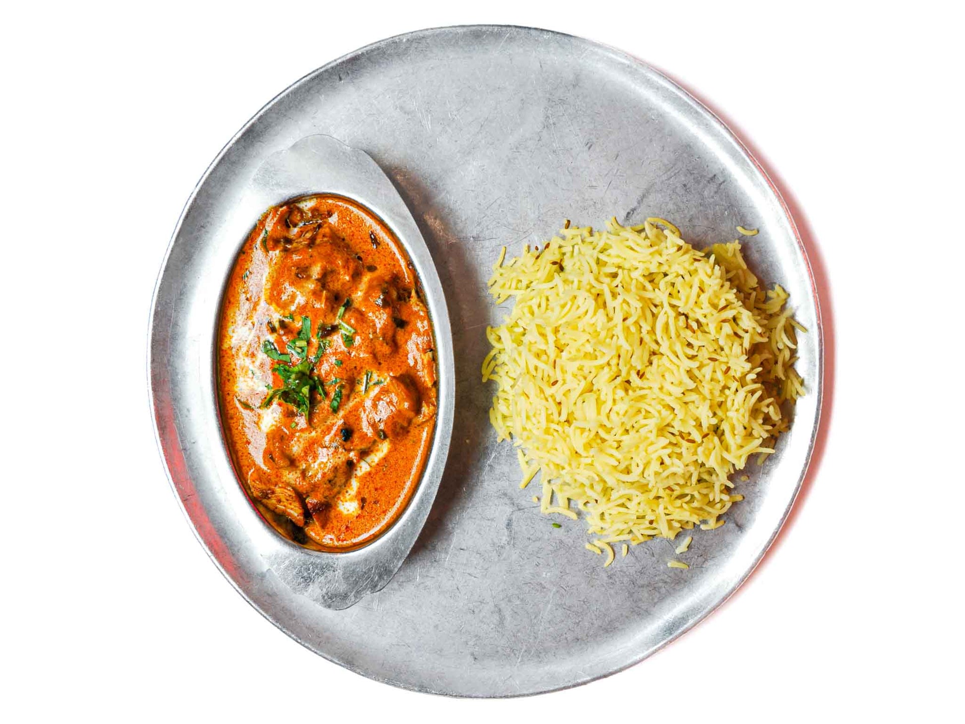 Zareen's Chicken Tikka Masala is a flavorful dish, featuring charcoal-grilled boneless chicken in a smoky tomato-cream curry. An essential for the fridge that's quick and easy to make. 