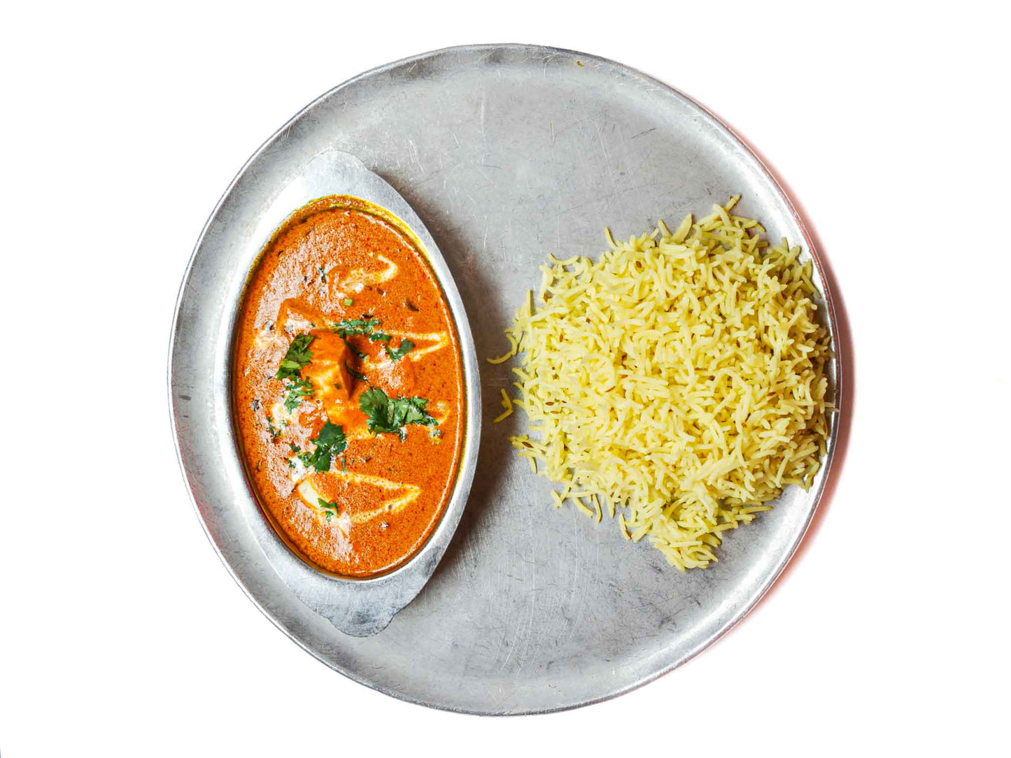 Zareen's Paneer Tikka Masala is a mix of flavors with tender paneer in a creamy tomato curry, and fragrant rice. Makes for an easy weekday meal! 