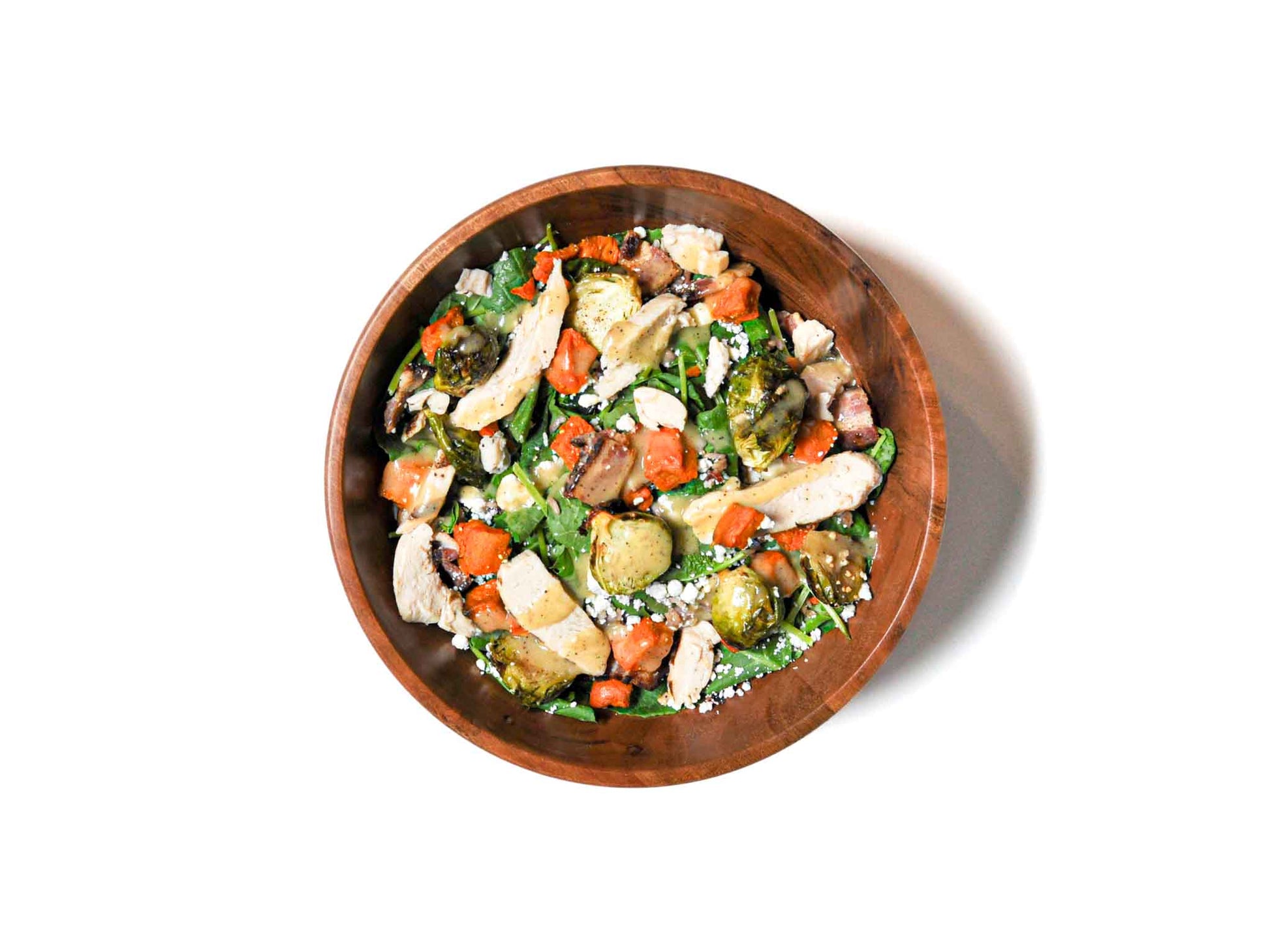 Tenderleaf's Autumn Harvest Brussel Bowl is a seasonal delight featuring roasted Brussels sprouts, tender sweet potatoes, tangy feta, and crisp apples. This vibrant bowl blends earthy, sweet, and creamy flavors, delivering a wholesome, nourishing dish that celebrates the best of autumn’s harvest.