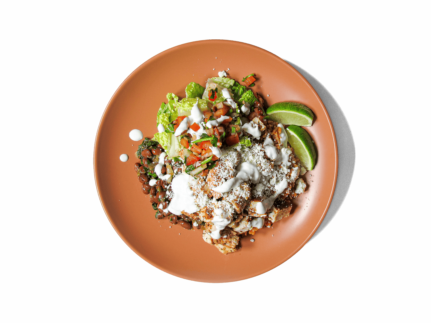 A vibrant, protein-rich dish featuring achiote-marinated chicken and hearty pinquito beans. Fresh chopped romaine and cotija cheese add crispness and creaminess, while a side of chili pico de gallo brings a bold kick. Finished with lime wedges and an optional drizzle of cilantro crema, this balanced meal is packed with flavor, protein, and nourishing ingredients to fuel your day.