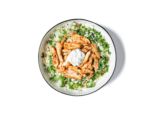 Sumac's Chicken Gyro Bowl showcases juicy, marinated chicken served over fragrant basmati rice, topped with a dollop of creamy tzatziki sauce. This hearty and refreshing dish delivers vibrant Mediterranean flavors in every bite.