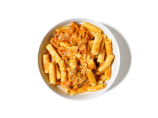 Tenderleaf's Tikka Masala Pasta features al dente rigatoni pasta tossed in a rich, creamy tikka masala sauce. This dish combines the comforting textures of pasta with the bold, aromatic flavors of Indian spices, creating a unique and satisfying fusion meal.