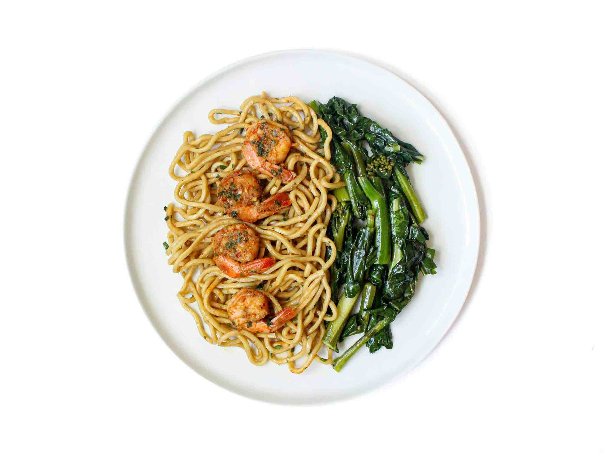 SF Noodle Bar's Garlic Shrimp and Baby Bok Choy offers succulent, garlicky shrimp combined with fresh baby bok choy on a bed of savory garlic noodles. This dish is a flavorful fusion of seafood and greens, ideal for a fresh and satisfying dining experience.