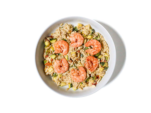 Tenderleaf's Shrimp Orzo Pasta Salad features succulent shrimp tossed with tender orzo, tangy sun-dried tomatoes, and crumbled feta cheese. This dish offers a delightful mix of Mediterranean flavors, combining the savory taste of shrimp with the rich, slightly sweet notes of sun-dried tomatoes and the creamy saltiness of feta, creating a fresh and satisfying meal.