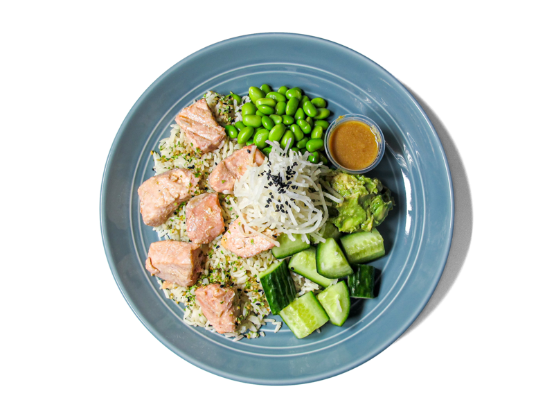 Glazed miso salmon served over aromatic bone broth jasmine rice. This nourishing bowl combines rich umami flavors with wholesome ingredients, creating a warm and satisfying meal.