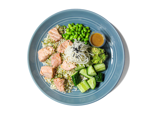 Glazed miso salmon served over aromatic bone broth jasmine rice. This nourishing bowl combines rich umami flavors with wholesome ingredients, creating a warm and satisfying meal.