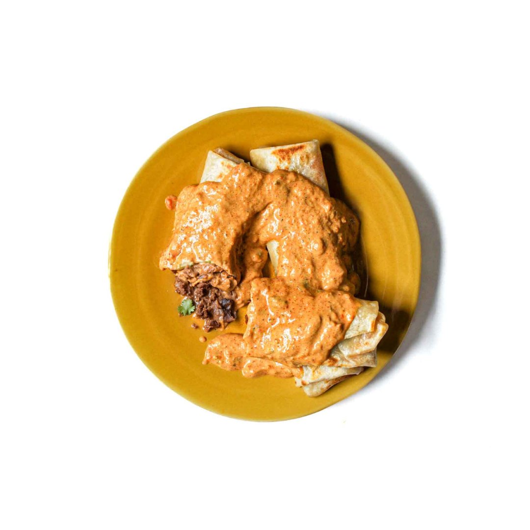 Tikka Masala over Bean and Cheese Burritos Product Image