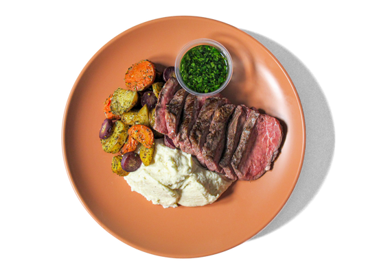 Tender, juicy steak served alongside crispy smashed purple potatoes topped with Parmesan. Accompanied by roasted carrots, parsnips, and a fresh basil chimichurri, this hearty dish delivers bold flavors and a perfect balance of rich, savory notes and vibrant herbal freshness.